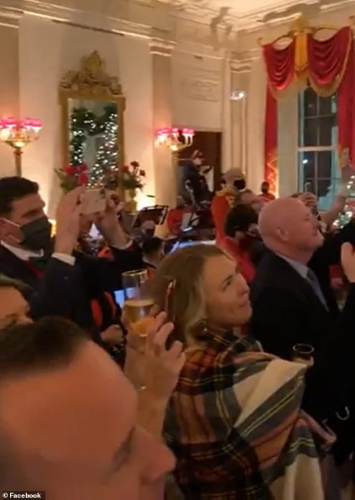 The video showed attendees standing closely together as they listened to the president speak